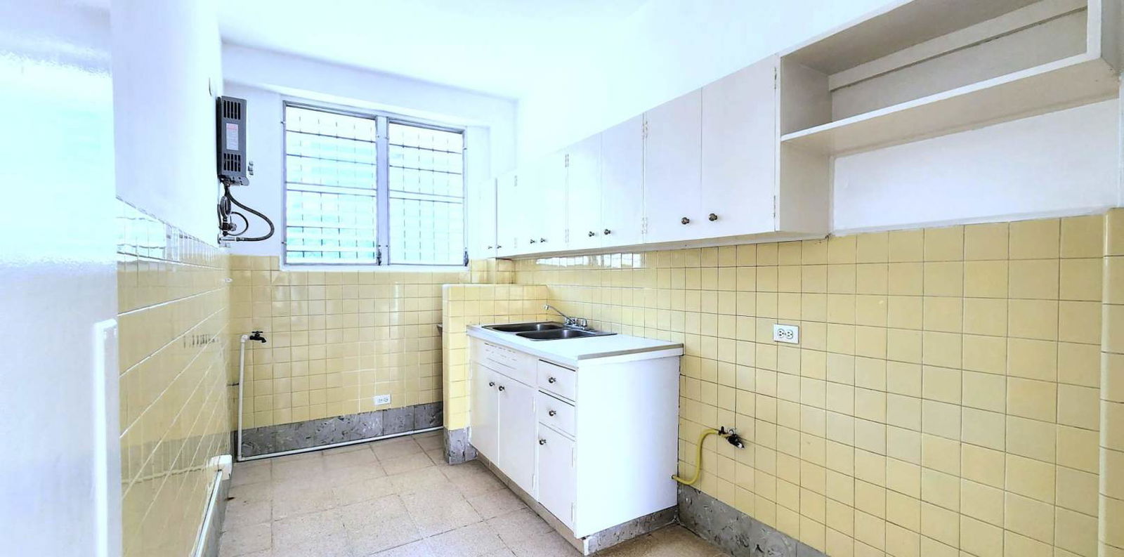 Spacious bright living room with tile floor, ceiling fan, and open balcony in Bella Vista Panama City