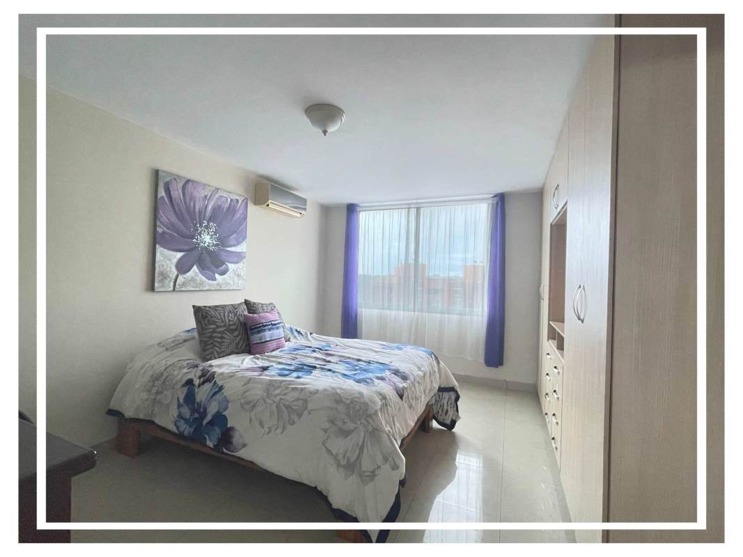 Master bedroom with large windows and city skyline view PH Villa de las Fuentes Panama