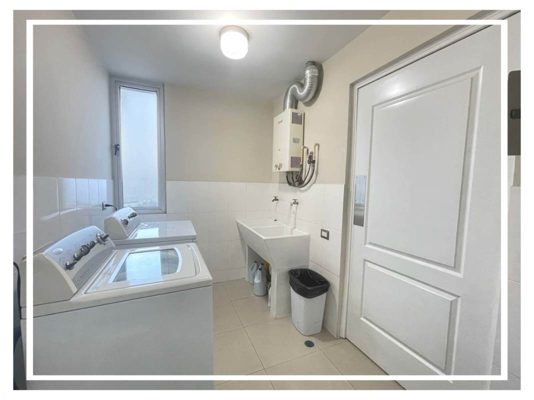 Living room with large panoramic windows city skyline PH Villa de las Fuentes Panama City