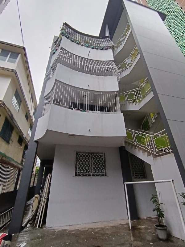 Street facade with balconies on investment residential apartment building San Francisco Panama