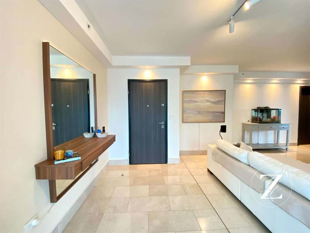 Spacious master bedroom with large windows ocean view walk-in closet PH Vita Coco del Mar