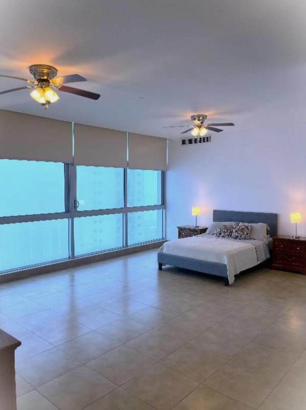 Modern dining room with large windows overlooking Pacific Ocean in Ten Tower Costa del Este Panama City