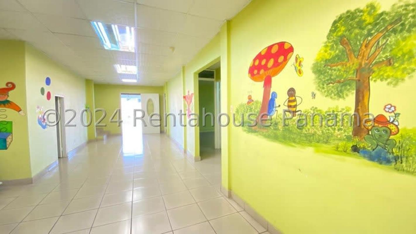 Interior hallway with vibrant murals ideal for daycare in Dorasol Panama