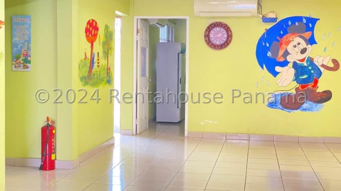 Lobby with murals, air conditioning, wall clock in Dorasol duplex Panama City