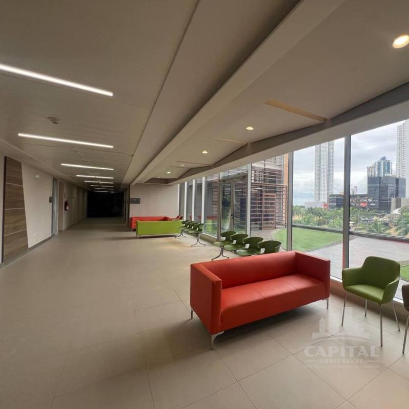 Building lobby with large windows and lounge chairs Town Center Costa del Este