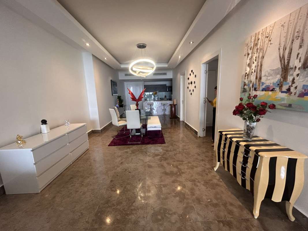 Modern master bedroom with ocean view, large windows, balcony access at PH Yoo Panama Avenida Balboa Panama City