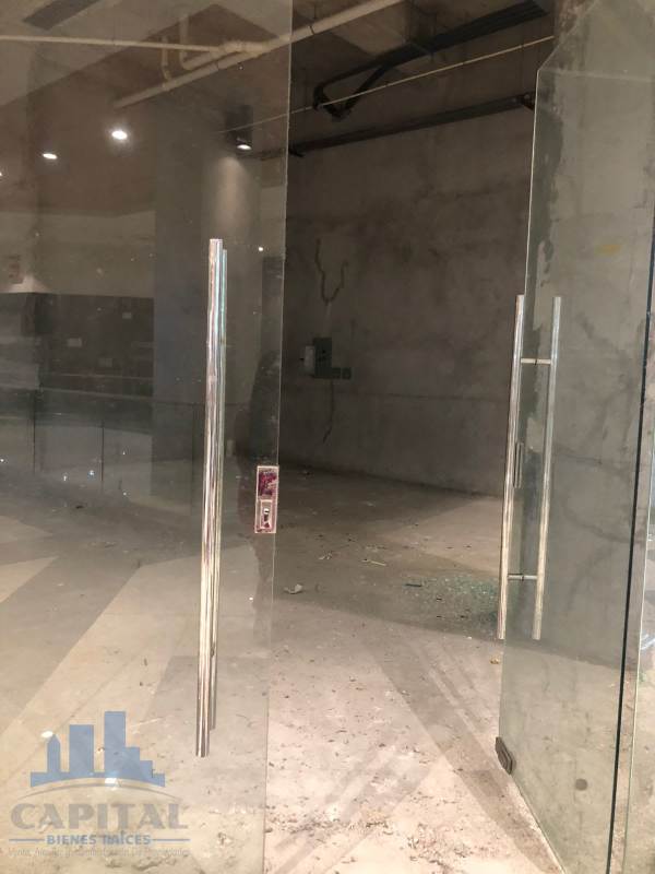 Commercial retail unit with double glass doors and unfinished interior in Dorado Mall Panama City