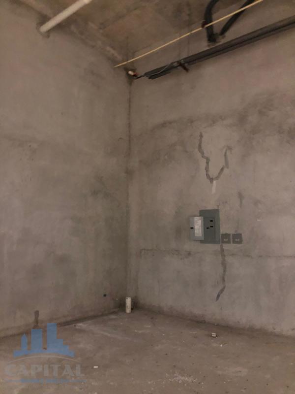 Empty commercial retail unit with glass storefront in prominent Dorado Mall Panama City for rent