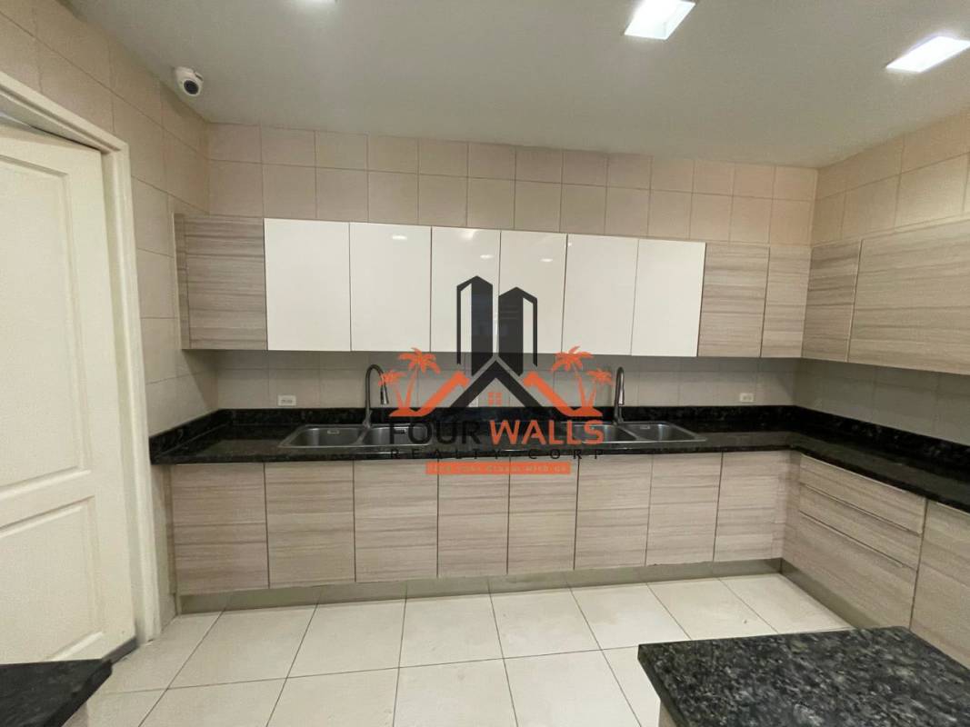 Luxurious bathroom with double sinks, marble finishes, glass enclosed shower in PH D1 Punta Paitilla Panama City