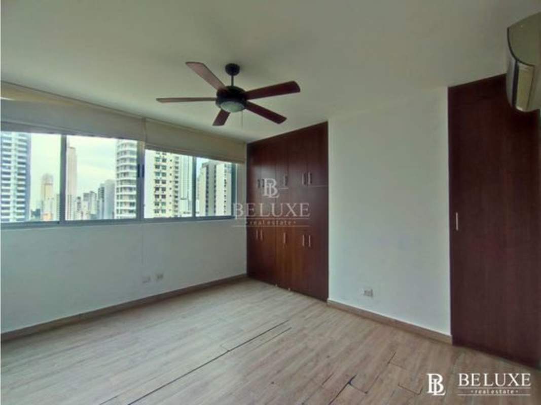 Bedroom with large window, wooden closet, AC in PH Harmony San Francisco Panama