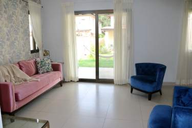 Bright open dining and living room with furniture in Woodlands Panama Pacifico rental house