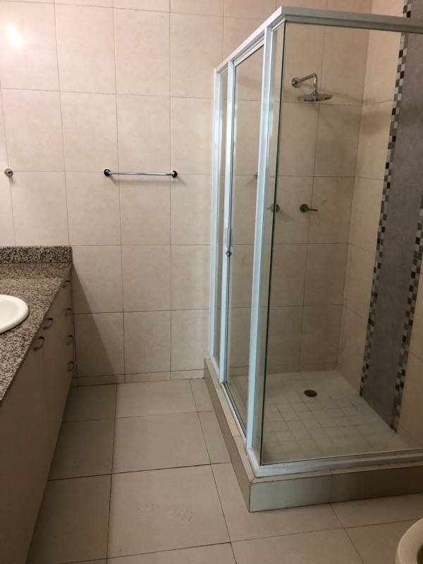 Bathroom with walk-in glass shower granite vanity PH Cosmopolitan in San Francisco Panama