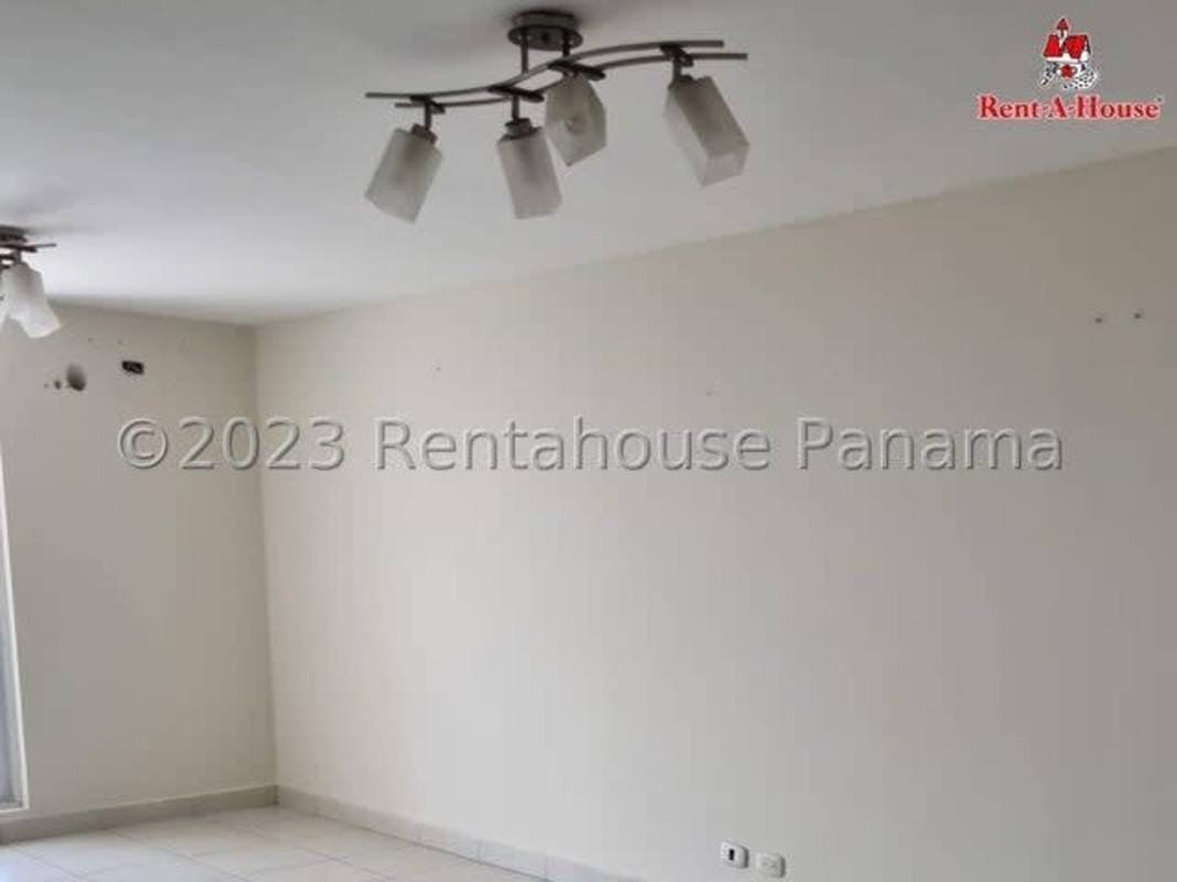 Kitchen with granite countertop, gas range, white cabinets in PH Cantabria Residences Brisas del Golf