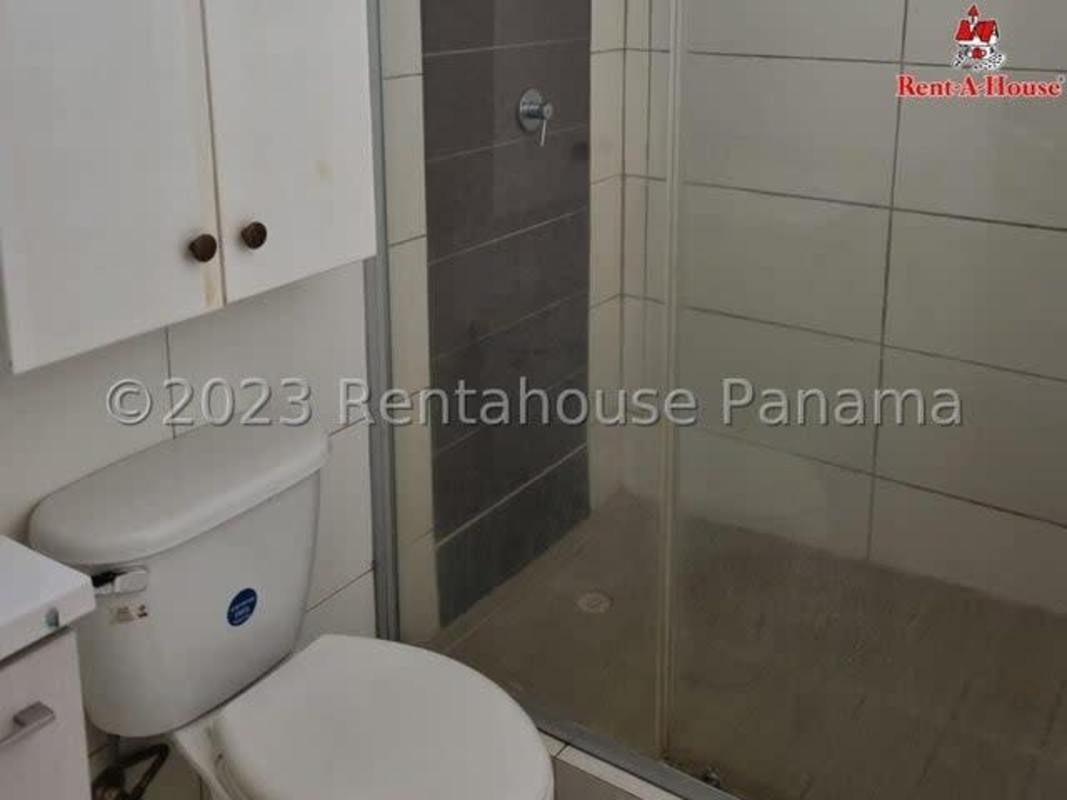 Compact kitchen with granite counter connected to laundry area in apartment PH Cantabria Brisas del Golf