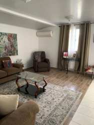 Living room with AC and large window in house for sale in Valle Dorado La Chorrera