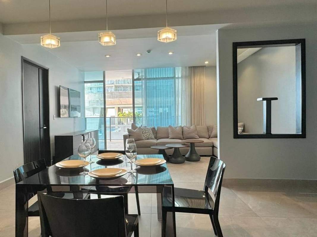 Bright modern open plan with dining and living overlooking ocean PH Grand Tower