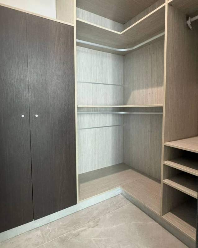 Large walk-in closet with modern shelving PH Grand Tower Punta Pacífica