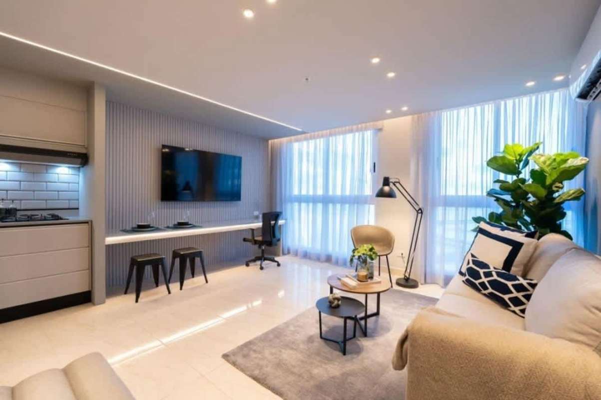 Modern minimalist living room with city view and large windows PH The Gray