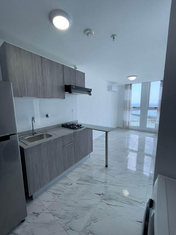 Modern minimalist kitchen and living room with ocean view PH The Gray