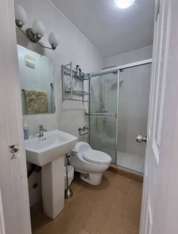 Rooftop swimming pool area with pergola, loungers, skyline view at PH Vista Argentina Panama City