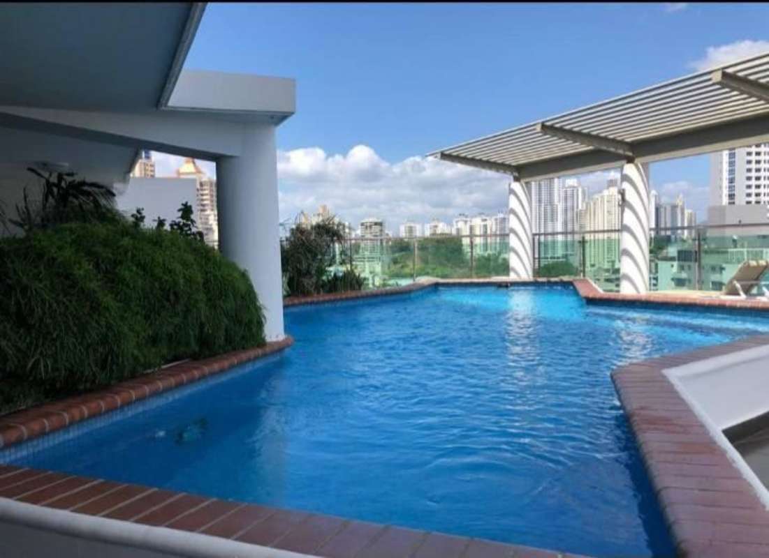 Bedroom with window curtains, AC unit, wooden floors PH Vista Argentina El Cangrejo Panama City