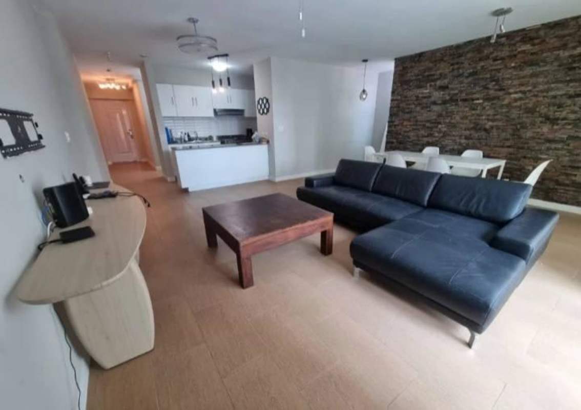 Modern bathroom with glass shower door, pedestal sink, tiled walls in PH Vista Argentina Panama City