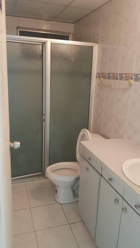 Bright private office room with tiled floors, AC, and natural light commercial house Panama