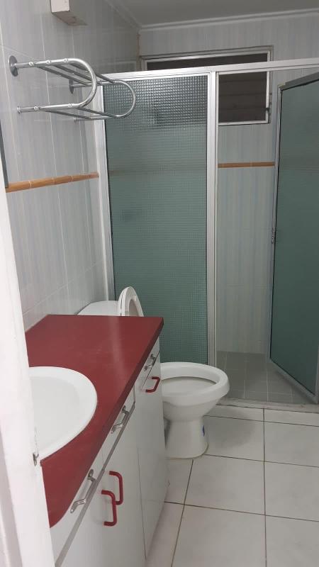 Equipped kitchen with wood cabinets, granite countertops, and stove in commercial rental Panama City