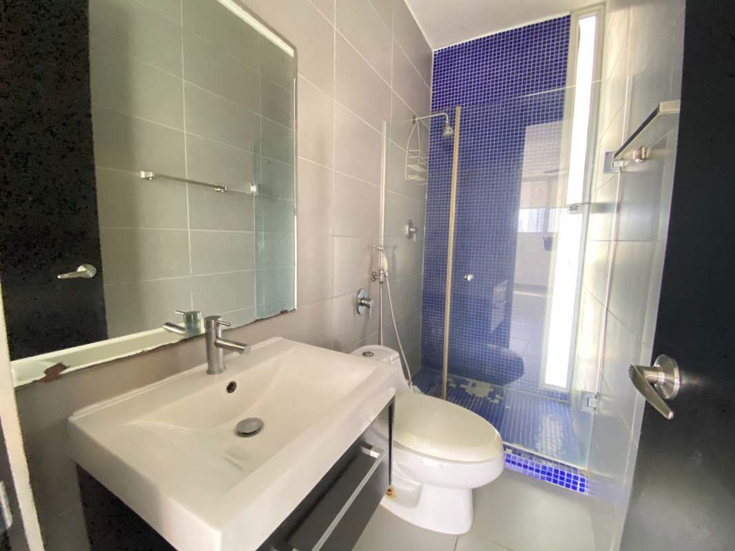 Laundry room with water heater, utility sink, and window for ventilation in PH Trio Panama