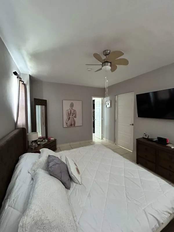 Modern master bedroom with TV, fan, large closet in PH Augusta Brisas del Golf Panama City
