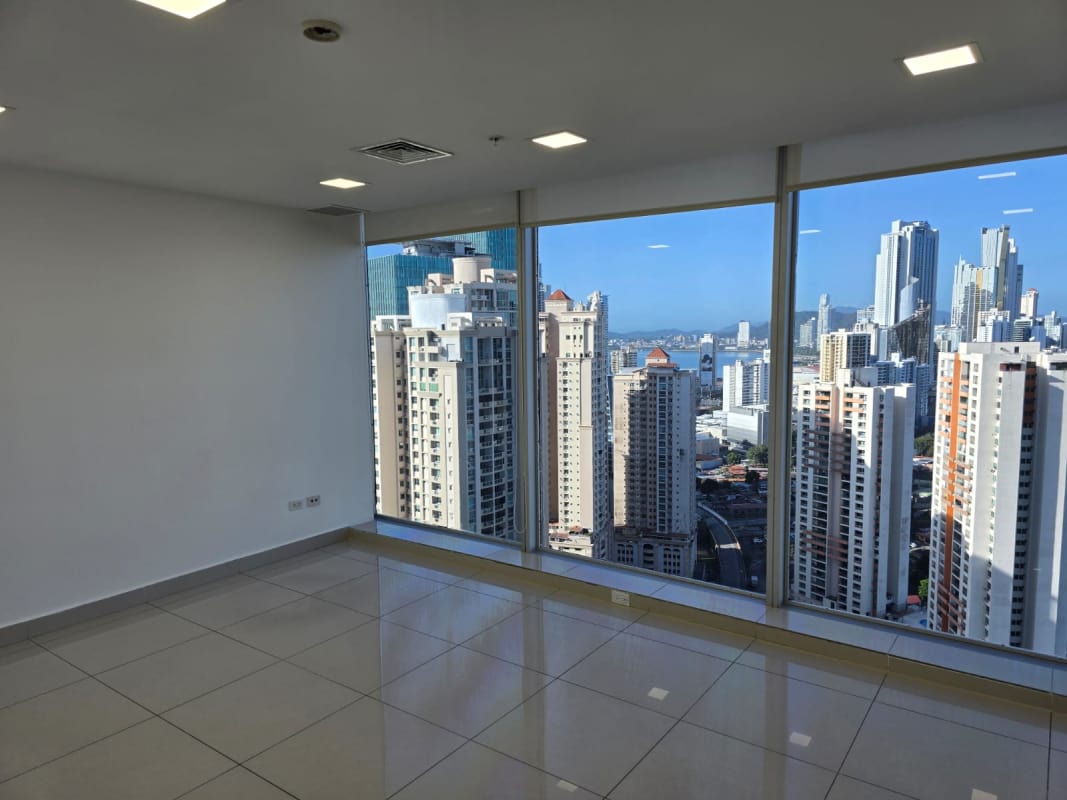 Commercial office space with floor-to-ceiling windows overlooking Panama City skyline at PH Oceania