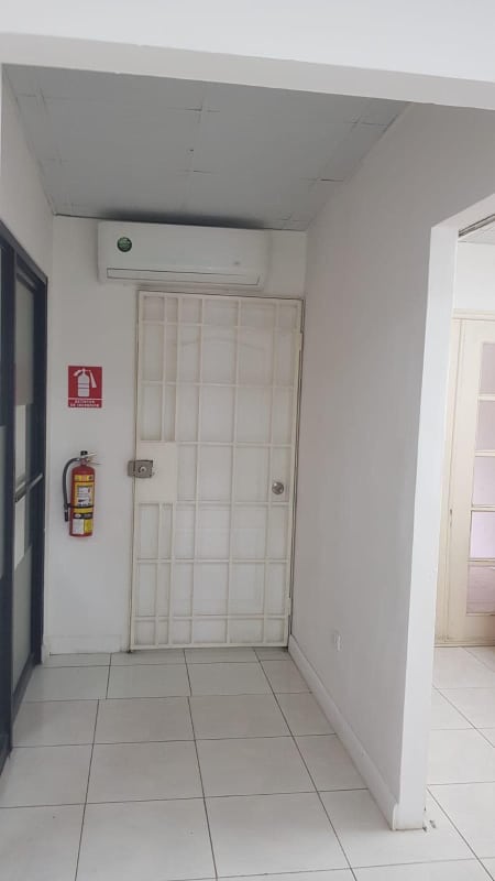 Garden patio area of office complex with plants and outdoor seating Panama