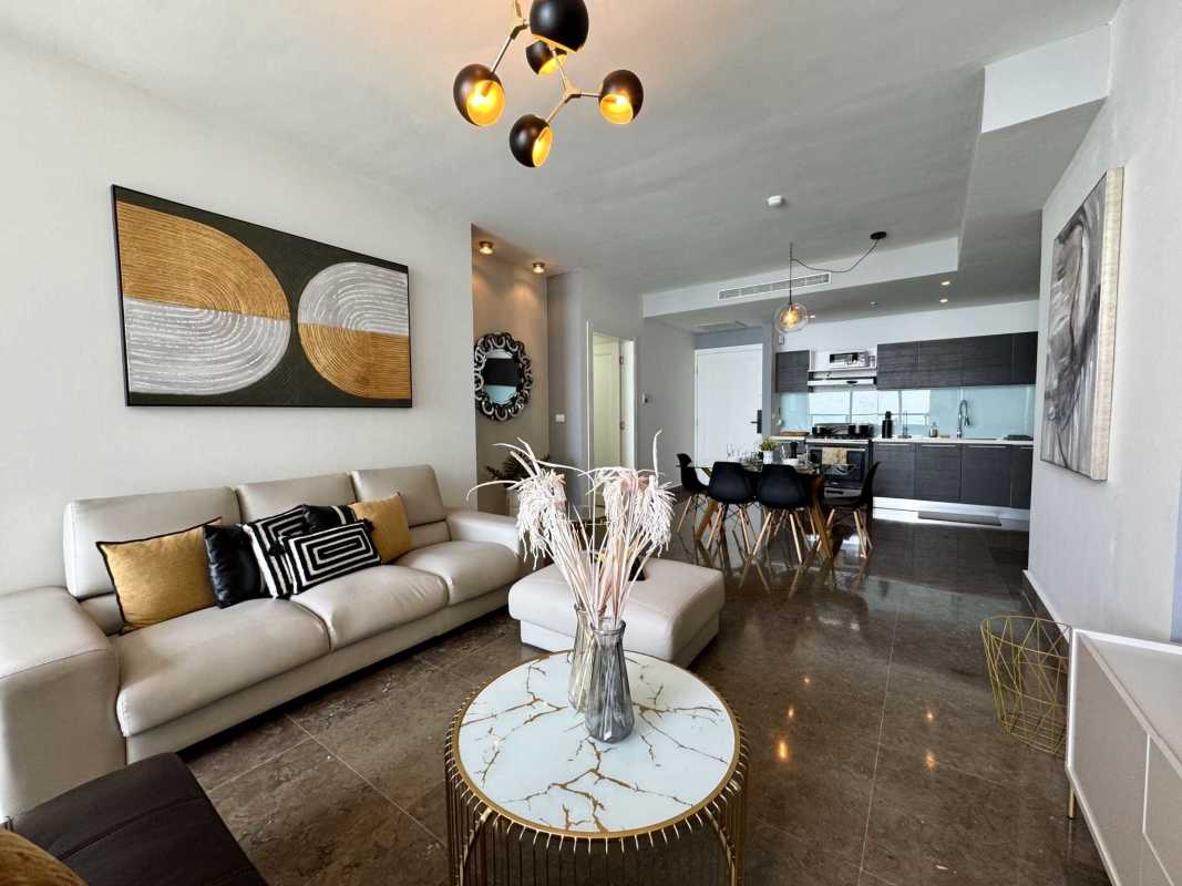 Elegant modern living room with ocean view windows at PH Yoo Panama Avenida Balboa