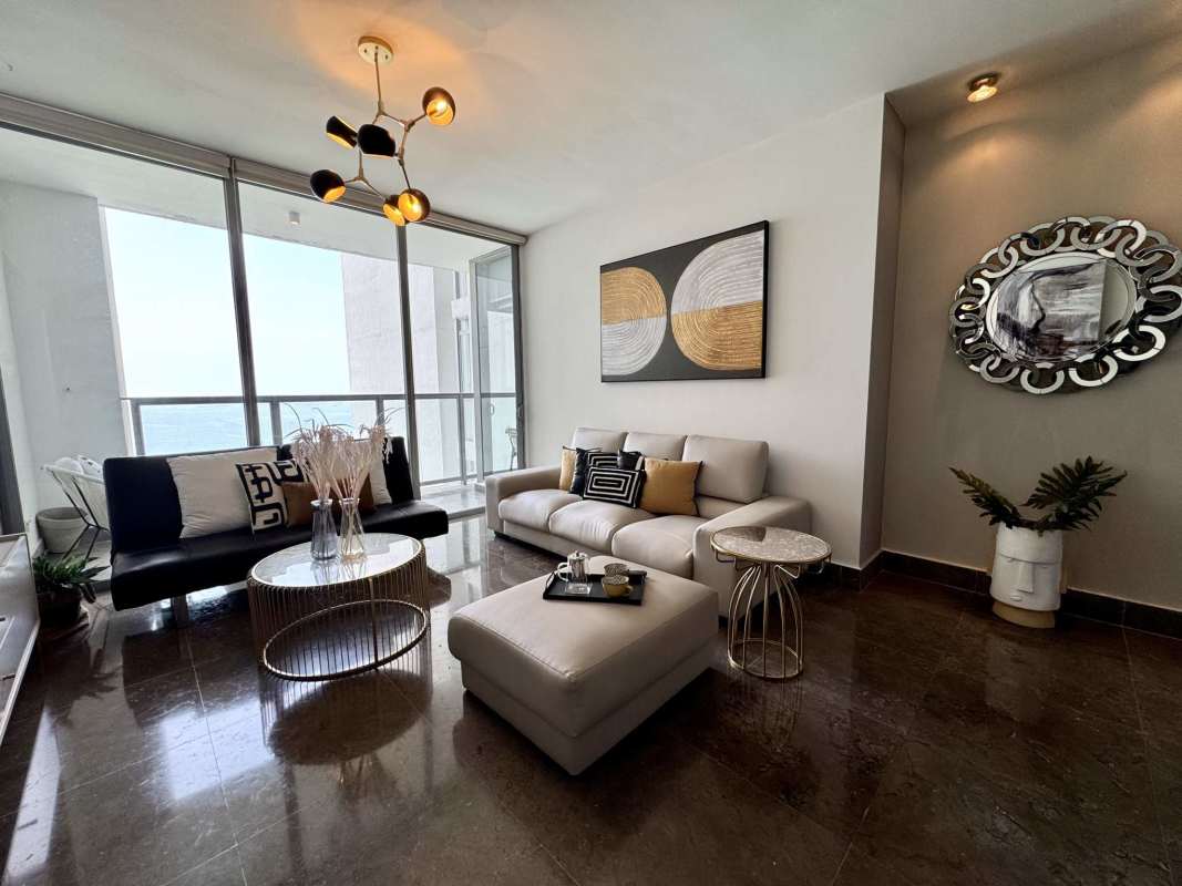 Open kitchen with dining area and balcony access in luxury apartment PH Yoo Panama