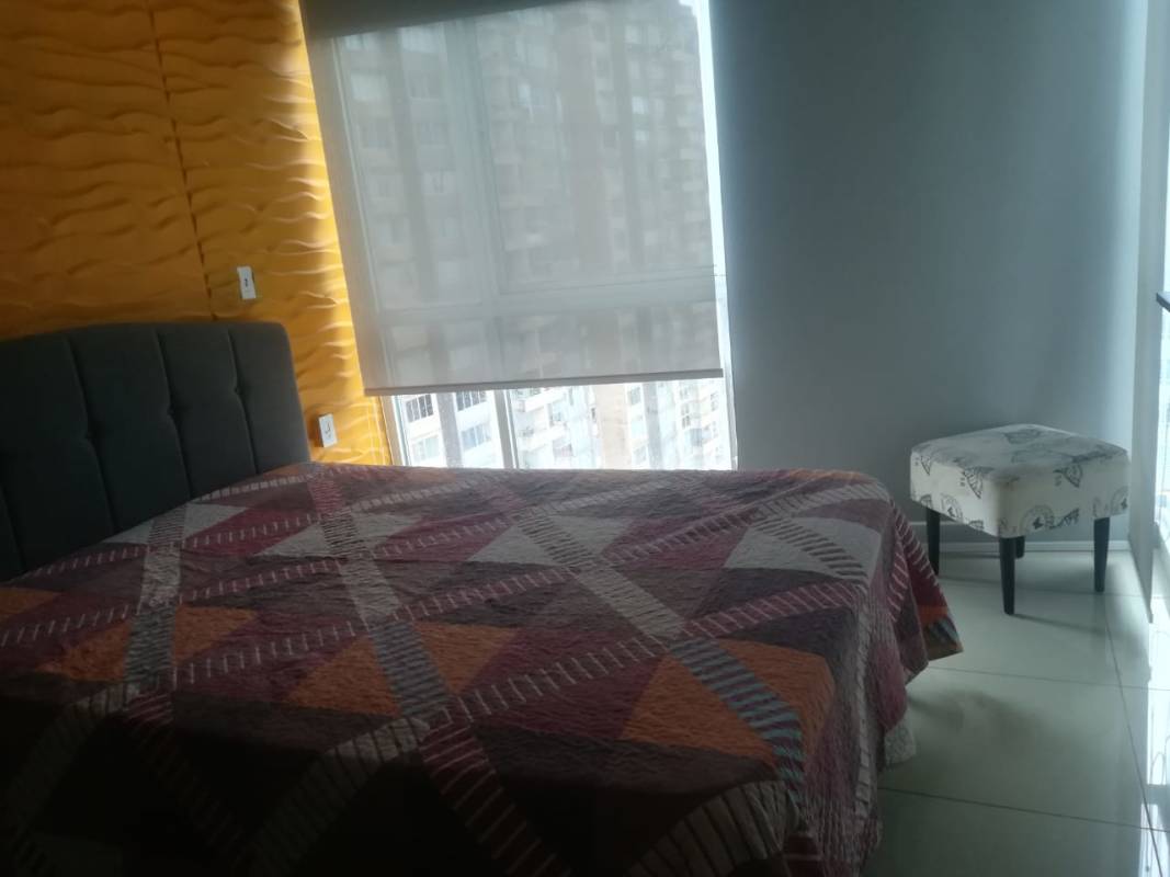 Bedroom with large window, closet, AC and city view in PH Coral Tower Panama