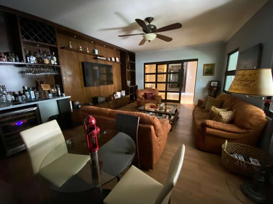 Contemporary living room featuring entertainment center and wet bar Palmeras Costa del Este Panama