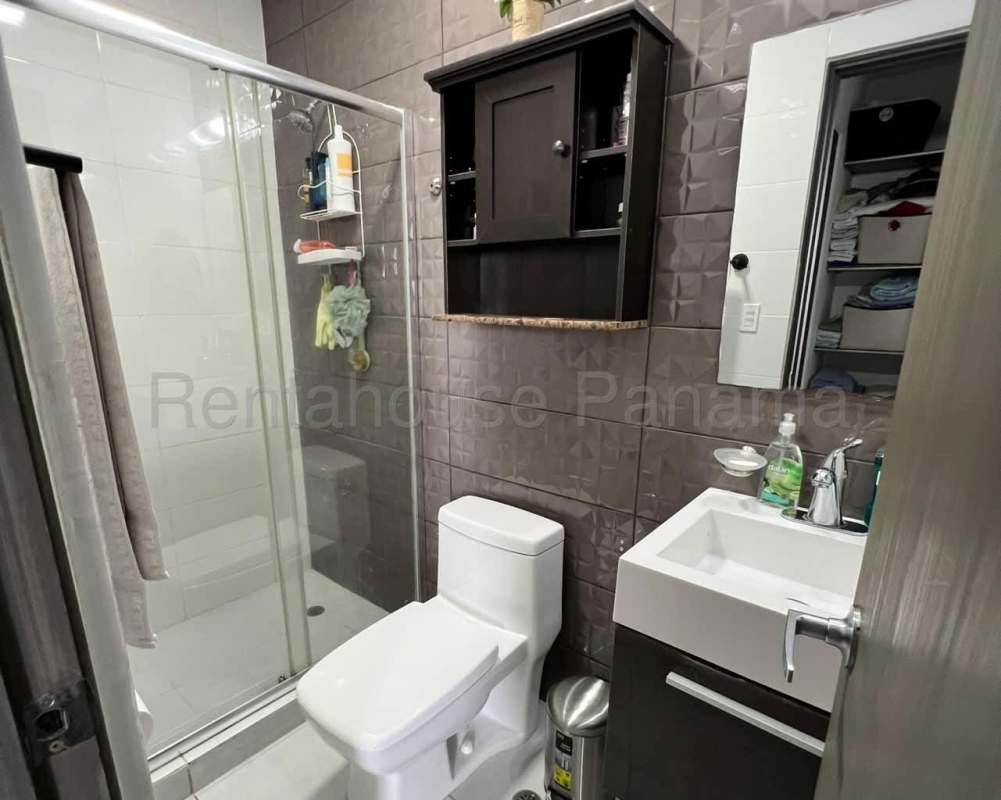 Bathroom with modern fixtures glass shower enclosure ceramic tiles Metropolitan Park Panama