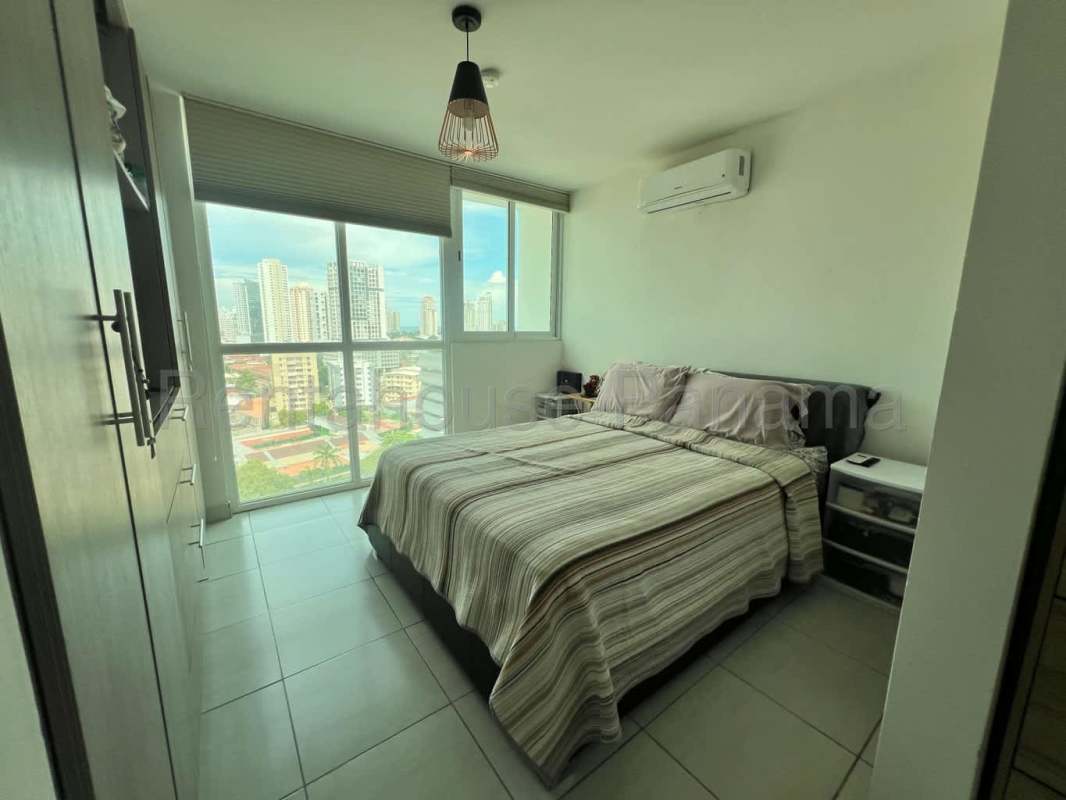 Bedroom featuring wardrobe storage tiled floors and natural lighting apartment for rent in Panama City