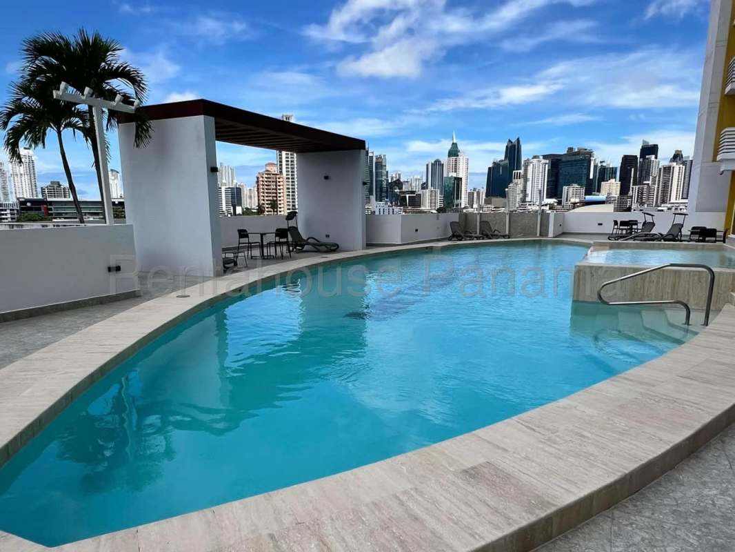 Infinity pool and jacuzzi on rooftop with skyline views at Metropolitan Park Tower in Carrasquilla Panama