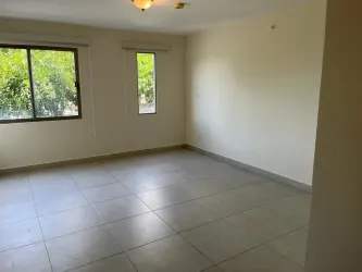 Bright living room with large sliding doors to balcony PH Green Village Howard Panama