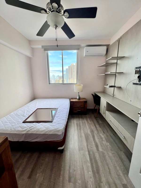 Condo swimming pool with sun deck lounge chairs at PH Pueblo Nuevo Tower Panama