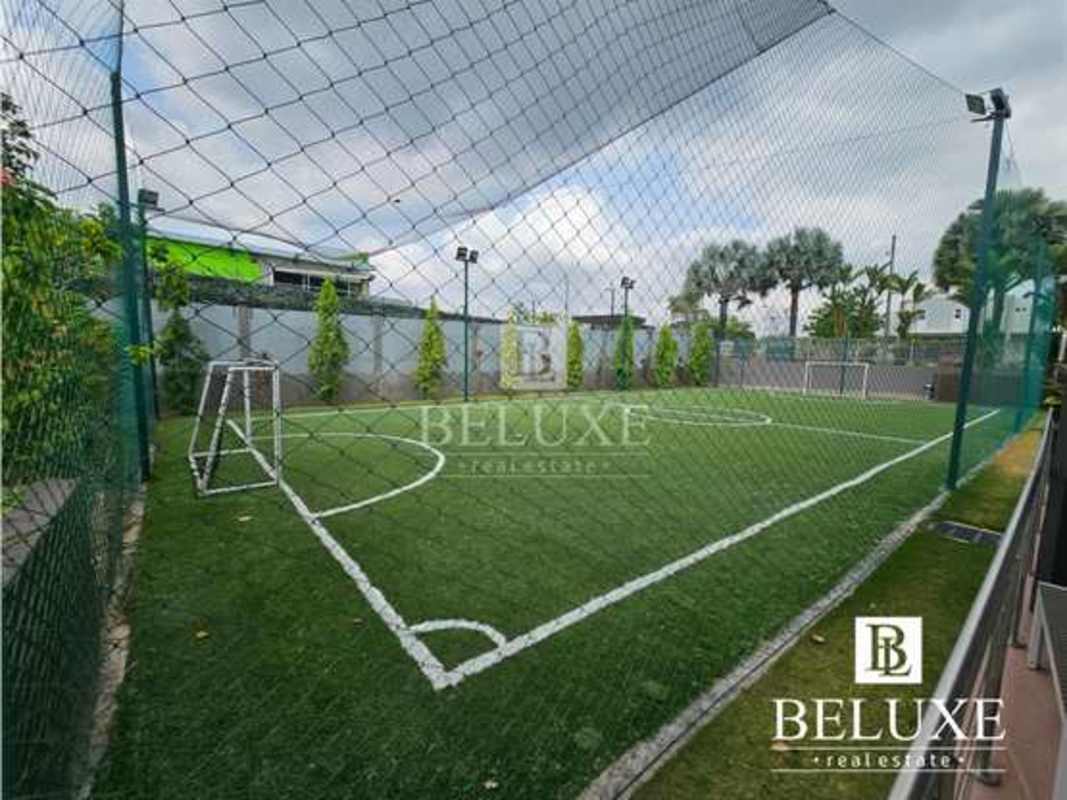 Outdoor synthetic soccer field with fence community PH Victoria Brisas del Golf Panama