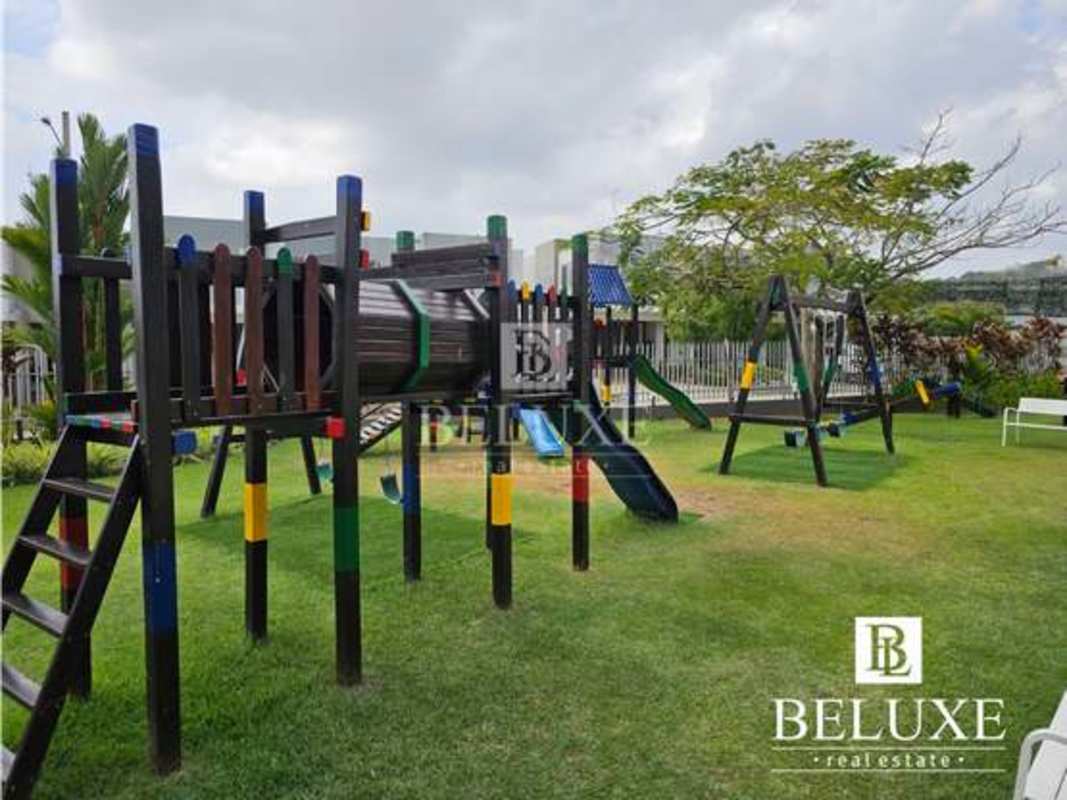 Outdoor playground with swings, slides at PH Victoria in Brisas del Golf Panama City