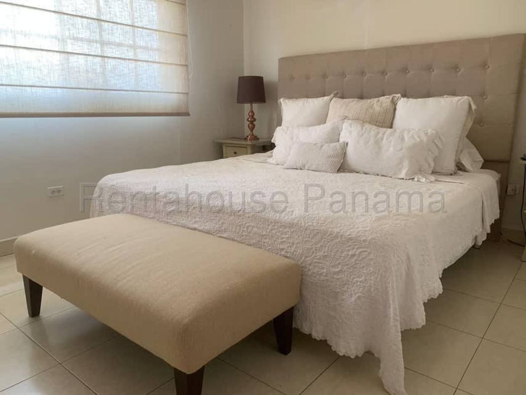 Bedroom with king bed, beige headboard, window blinds Panama City