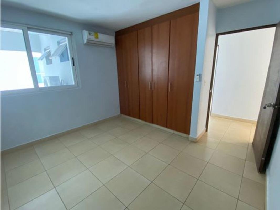 Bedroom with large wardrobe, split AC and city view in Bella Vista Panama City