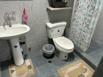 Covered outdoor terrace with garden view in Altos de Vacamonte furnished house