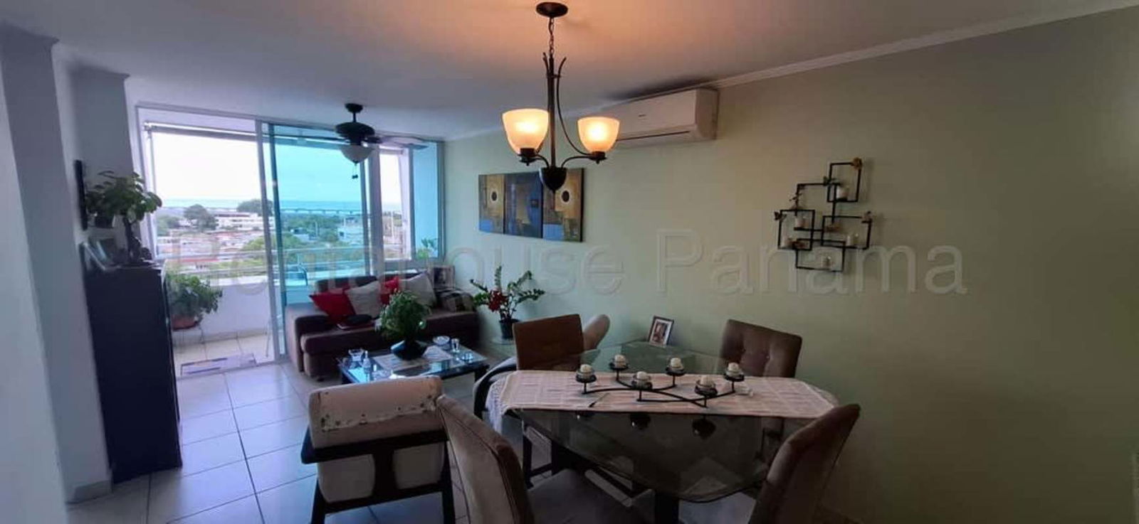 Bedroom with large window overlooking city PH Parque Lefevre Panama City