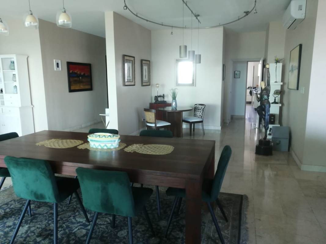 Spacious modern kitchen with island, built-in oven, and gas stove in PH Yacht Club Panama City
