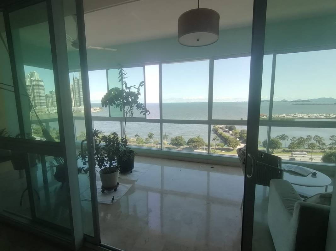 Modern bathroom with marble finishes, double vanity, glass shower in PH Yacht Club Panama