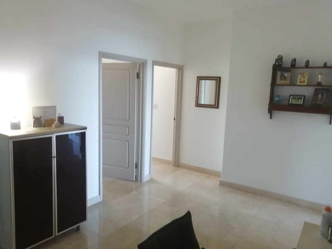 Open-concept living and dining room with views of the bay at Yacht Club Tower Panama